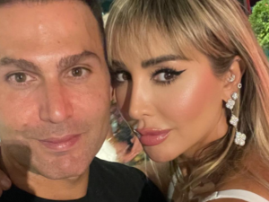 Joelle gives her husband sweet kiss on the lips