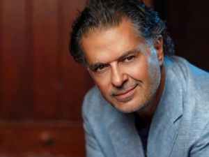 Ragheb Alama wears pink suit to support his son