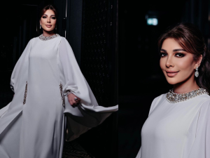 Assala wears bathrobe to brother's wedding