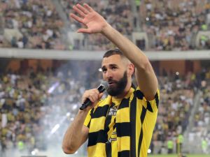 French forward Karim Benzema greets the crowd during his unveiling at King Abdullah Sports City stadium in Jeddah, on June 8, 2023. Benzema was unveiled as an Al-Ittihad player in front of thousands of fans in Saudi Arabia on June 8, a day after the oil-rich kingdom just failed to reel in Lionel Messi. (Photo by AFP)