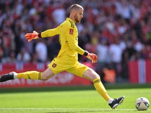Manchester United's Spanish goalkeeper David de Gea takes a kick during the English FA Cup final football match between Manchester City and Manchester United at Wembley stadium, in London, on June 3, 2023. (Photo by Glyn KIRK / AFP) 