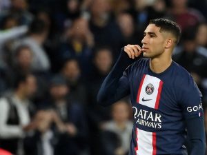 Paris Saint-Germain's Moroccan defender Achraf Hakimi reacts after scoring his teams second goal during the French L1 football match between Paris Saint-Germain (PSG) and Ajaccio at the Parc des Princes in Paris on May 13, 2023. (Photo by FRANCK FIFE / AFP)