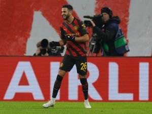 Manchester City's Algerian midfielder Riyad Mahrez celebrates scoring the opening goal during the UEFA Champions League round of 16, first-leg football match between RB Leipzig and Manchester City in Leipzig, eastern Germany on February 22, 2023. (Photo by Odd ANDERSEN / AFP)