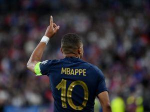 France's forward Kylian Mbappe celebrates after scoring the team's first goal during the UEFA Euro 2024 group B qualification football match between France and Greece at the Stade de France in Saint-Denis, in the northern outskirts of Paris, on June 19, 2023. (Photo by FRANCK FIFE / AFP)
