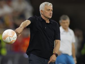 AS Roma's Portuguese coach Jose Mourinho throws the ball during the UEFA Europa League final football match between Sevilla FC and AS Roma at the Puskas Arena in Budapest on May 31, 2023. (Photo by Odd ANDERSEN / AFP)