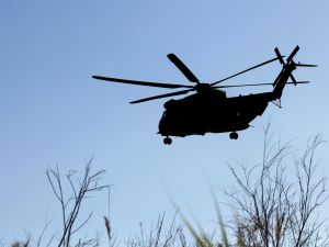 A Sikorsky CH-53K King Stallion helps searching the Sea of Galilee coasts for remains of a reported drone launched from Syria and intercepted by a Patriot missile on July 11, 2018. (Photo by JALAA MAREY / AFP) reconnaissance plane
