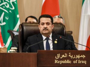 raqi Prime Minister Mohamed Shia al-Sudani attends the "Baghdad Conference for Cooperation and Partnership" in Sweimeh by the Dead Sea shore in central-west Jordan on December 20, 2022. (Photo by Khalil MAZRAAWI / AFP) Al-Sudani
