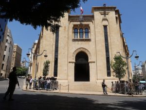Journalists gather outside the parliament building during the 12th session to elect a new president in the capital Beirut's downtown district on June 14, 2023.  (Photo by ANWAR AMRO / AFP) Beirut