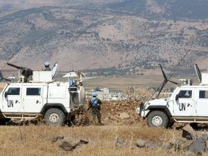 Peacekeepers with the United Nations Interim Force in Lebanon (UNIFIL) patrol an area on the Lebanon-Israel border on July 6, 2023. (Photo by Mahmoud ZAYYAT / AFP) UNIFIL