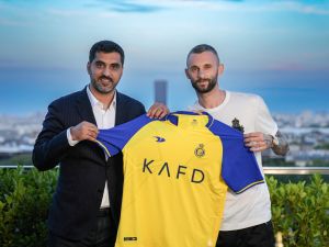 This handout picture released by Saudi Arabia's al-Nassr football club on July 3, 2023 shows Nassr's new Croatian midfielder Marcelo Brozovic (R) with the club's Executive President Ahmed al-Ghamdi after signing with them in Paris. (Photo by Al Nassr Football Club / AFP)