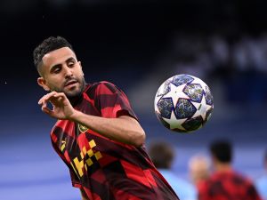 Manchester City's Algerian midfielder Riyad Mahrez warms up before the start of the UEFA Champions League semi-final first leg football match between Real Madrid CF and Manchester City at the Santiago Bernabeu stadium in Madrid on May 9, 2023. (Photo by OSCAR DEL POZO / AFP)