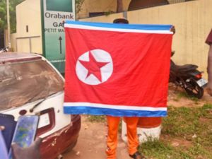 Niger pro-junta protester was seen carrying North Korean flag. (X/Twitter) North Korean flag
