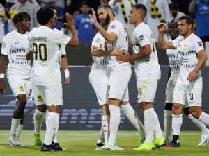 Ittihad's French forward Karim Benzema (C) celebrates with teammates after scoring his team's second goal during the 2023 Arab Club Champions Cup group A football match between Tunisia's Esperance de Tunis and Saudi Arabia's Al-Ittihad at the King Fahd Stadium in Taif on July 27, 2023. (Photo by AFP)