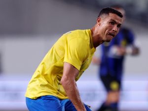 Al-Nassr's Cristiano Ronaldo (C) passes the ball during a friendly football match between Saudi Arabia's Al-Nassr and Italy's Inter Milan at Nagai Stadium in Osaka on July 27, 2023. (Photo by PAUL MILLER / AFP)
