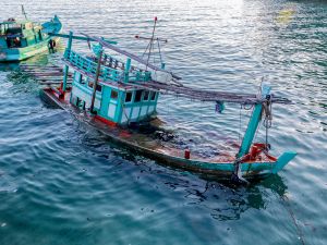 Boat sinks in the sea