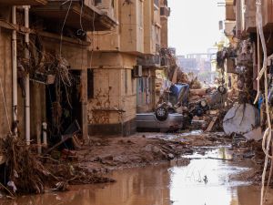 Overturned cars lay among other debris caused by flash floods in Derna, eastern Libya, on September 11, 2023. (Photo by AFP) Libya storm daniel