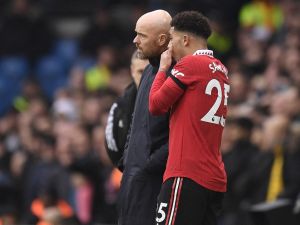 Manchester United's English striker Jadon Sancho (R) speaks with Manchester United's Dutch manager Erik ten Hag (L) during the English Premier League football match between Leeds United and Manchester United at Elland Road in Leeds, northern England on February 12, 2023. (Photo by Oli SCARFF / AFP) 