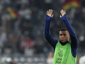 France's forward #10 Kylian Mbappe waves after the friendly football match between Germany and France the Signal Iduna Park stadium in Dortmund, western Germany, on September 12, 2023. (Photo by FRANCK FIFE / AFP)
