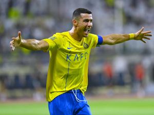 Nassr's Portuguese forward #07 Cristiano Ronaldo celebrates after scoring during the Saudi Pro League football match between Al-Nassr and Al-Fateh at the Prince Abdullah Bin Jalawi Stadium in al-Hasa, on August 25, 2023. (Photo by Ali Al-HAJI / AFP)