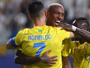 Nassr's Brazilian forward #94 Talisca (C) celebrates after scoring a goal with teammates Nassr's Portuguese forward #07 Cristiano Ronaldo and Nassr's Senegalese Forward #10 Sadio Mane (R) during the AFC Champions League Group E football match between Saudi's al-Nassr and Qatar’s al-Duhail at the King Saud University Stadium in Riyadh on October 24, 2023. (Photo by Fayez NURELDINE / AFP)