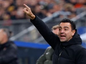 تشافي هيرنانديز (Photo by Axel Heimken / AFP)