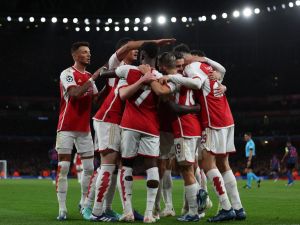 Arsenal's players celebrate their opening goal during the UEFA Champions League Group B football match between Arsenal and Sevilla at the Emirates Stadium in north London on November 8, 2023. (Photo by Adrian DENNIS / AFP)