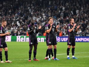 (LtoR) Bayern Munich's German midfielder #06 Joshua Kimmich, Bayern Munich's French defender #02 Dayot Upamecano, Bayern Munich's German midfielder #08 Leon Goretzka and Bayern Munich's English forward #09 Harry Kane celebrate at the end of the UEFA Champions League Group A football match between FC Copenhagen and FC Bayern Munich in Copenhagen, Denmark on October 3, 2023. Bayern Munich won the match 2-1. (Photo by Sergei GAPON / AFP)