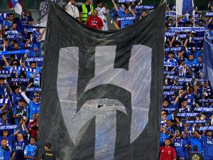 Supporters of al-Hilal cheer during the Saudi Pro League football match between Al-Hilal and Al-Shabab at Prince Faisal Bin Fahd Stadium in Riyadh on September 29, 2023. (Photo by Fayez NURELDINE / AFP)