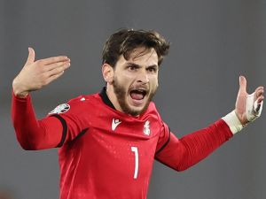 Georgia's midfielder #07 Khvicha Kvaratskhelia celebrates after scoring the team's first goal during the UEFA Euro 2024 football tournament Group A qualifying match between Georgia and Scotland in Tbilisi on November 16, 2023. (Photo by Giorgi ARJEVANIDZE / AFP)