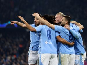 Manchester City's Norwegian striker #09 Erling Haaland (2R) celebrates scoring his team's third goal during the UEFA Champions League Group B second leg football match between Manchester City and Young Boys at the Etihad Stadium in Manchester, north west England, on November 7, 2023. (Photo by Darren Staples / AFP)