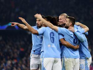 Manchester City's Norwegian striker #09 Erling Haaland (2R) celebrates scoring his team's third goal during the UEFA Champions League Group B second leg football match between Manchester City and Young Boys at the Etihad Stadium in Manchester, north west England, on November 7, 2023. (Photo by Darren Staples / AFP)