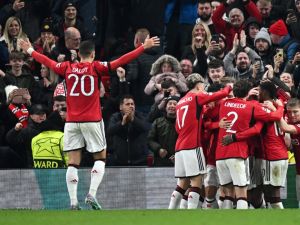 Manchester United's English defender #05 Harry Maguire (unseen) celebrates with teammates after scoring his team first goal during the UEFA Champions League Group A football match between Manchester United and FC Copenhagen at Old Trafford, in Manchester, north-west England, on October 24, 2023. (Photo by Paul ELLIS / AFP)
