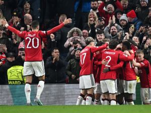 Manchester United's English defender #05 Harry Maguire (unseen) celebrates with teammates after scoring his team first goal during the UEFA Champions League Group A football match between Manchester United and FC Copenhagen at Old Trafford, in Manchester, north-west England, on October 24, 2023. (Photo by Paul ELLIS / AFP)