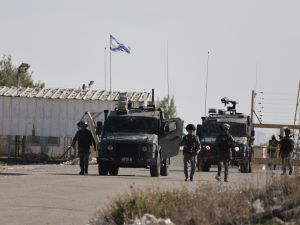 Israeli border guards take position outside the Ofer military camp between Ramallah and Baytunia in the occupied West Bank city amid preparations for the release of Palestinian prisoners in exchange for Israeli hostages held by Hamas in Gaza, on November 24, 2023.  (Photo by Jaafar ASHTIYEH / AFP) surveillance footage