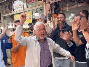 Shopkeeper Sadegh Bagheri arrested after his dancing video. (YouTube) Shopkeeper Sadegh Bagheri arrested after his dancing video