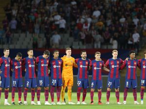 Barcelona's players line up before the start of the UEFA Champions League 1st round day 1 Group H football match between FC Barcelona and Royal Antwerp FC at the Estadi Olimpic Lluis Companys in Barcelona on September 19, 2023. (Photo by LLUIS GENE / AFP)