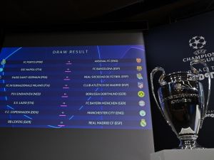 The results are displayed on a screen at the end of the 2023-2024 UEFA Champions League football tournament round of 16 draw at the House of European Football in Nyon, on December 18, 2023. (Photo by Fabrice COFFRINI / AFP)