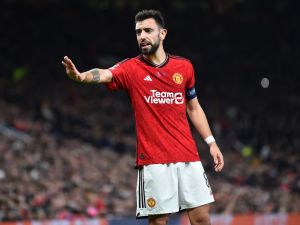 Manchester United's Portuguese midfielder #08 Bruno Fernandes gestures during the UEFA Champions League group A football match between Manchester United and FC Bayern Munich at Old Trafford stadium in Manchester, north west England, on December 12, 2023. (Photo by PETER POWELL / AFP)
