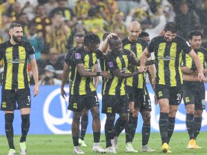 Ittihad's French forward #09 Karim Benzema (L) and Ittihad's French midfielder #07 N'Golo Kante (C) celebrate after a goal during the FIFA Club World Cup first round football match between Al-Ittihad and Auckland City at the King Abdullah Sports City stadium in Jeddah, on December 12, 2023. Al Ittihad secured progress from the first round of the Club World Cup with a convincing 3-0 win against Auckland City. (Photo by AFP)