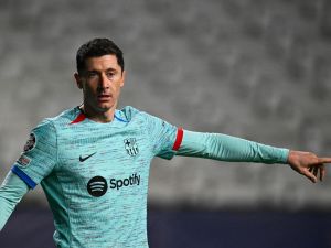 Barcelona's Polish forward #09 Robert Lewandowski gestures during the UEFA Champions League Group H football match between Royal Antwerp FC and FC Barcelona at the Bosuilstadion in Antwerp, on December 13, 2023. (Photo by JOHN THYS / AFP)