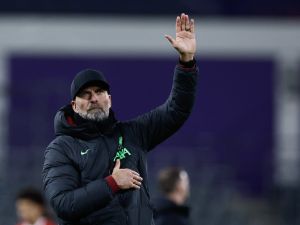 Liverpool's German manager Jurgen Klopp greets the public at the end of the UEFA Europa League football match between Union Saint Gilloise and Liverpool FC at the Lotto Park in Brussels on December 14, 2023. (Photo by Kenzo TRIBOUILLARD / AFP)