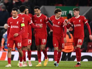 Liverpool's Dutch striker #18 Cody Gakpo (C) celebrates with teammates after scoring their fourth goal during the UEFA Europa League group E football match between Liverpool and Linzer ASK at Anfield in Liverpool, north west England on November 30, 2023. Liverpool won the game 4-0. (Photo by Oli SCARFF / AFP)