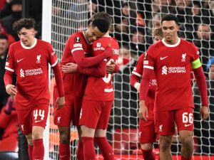Liverpool's Dutch striker #18 Cody Gakpo (2L) celebrates with teammates after scoring their fourth goal during the UEFA Europa League group E football match between Liverpool and Linzer ASK at Anfield in Liverpool, north west England on November 30, 2023. Liverpool won the game 4-0. (Photo by Oli SCARFF / AFP)