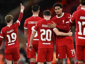 Liverpool's Portuguese striker #20 Diogo Jota (C) celebrates with teammates after scoring their second goal during the UEFA Europa League group E football match between Liverpool and Royale Union Saint-Gilloise at Anfield in Liverpool, north west England on October 5, 2023. Liverpool won the game 2-0. (Photo by Oli SCARFF / AFP)