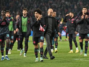 Manchester City's Spanish manager Pep Guardiola (Centre R) and Manchester City players celebrate after winning the UEFA Champions League Group G day 6 group stage football match between Crvena Zvezda (Red Star Belgrade) and Manchester City at the Red Star stadium in Belgrade, on December 13, 2023. (Photo by ANDREJ ISAKOVIC / AFP)