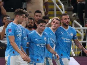 Manchester City's English midfielder #47 Phil Foden (2R) celebrates after with teammates scoring their third goal during the FIFA Club World Cup 2023 football final match between England's Manchester City and Brazil's Fluminense at King Abdullah Sports City Stadium in Jeddah on December 22, 2023. (Photo by Giuseppe CACACE / AFP)