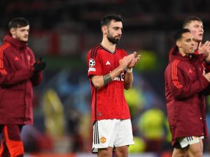 Manchester United's Portuguese midfielder #08 Bruno Fernandes reacts after the UEFA Champions League group A football match between Manchester United and FC Bayern Munich at Old Trafford stadium in Manchester, north west England, on December 12, 2023. (Photo by PETER POWELL / AFP)