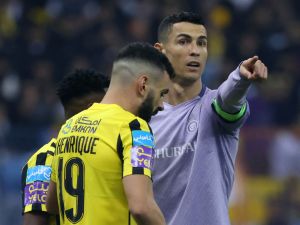 Nassr's Portuguese forward Cristiano Ronaldo (R) gestures during the Saudi Super Cup semi-final football match between Al-Ittihad and Al-Nassr at the King Fahd Stadium in Riyadh on January 26, 2023. (Photo by Fayez NURELDINE / AFP)