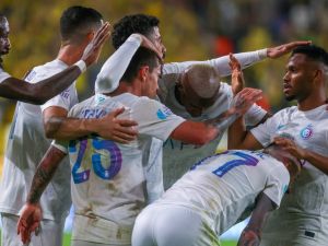 Nassr's Portuguese midfielder #25 Otavio (C) celebrates his goal with his team during the Saudi Pro League football match between Al-Nassr and Al-Riyadh at al-Awwal Park Stadium in Riyadh on December 8, 2023. (Photo by Fayez NURELDINE / AFP)