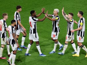 Newcastle United's Swedish striker #14 Alexander Isak (C-L) celebrates with Newcastle United's Brazilian midfielder #39 Bruno Guimaraes (C-R) and teammates after opening the scoring during the UEFA Champions League 1st round, day 5, Group F football match between Paris Saint-Germain (PSG) and Newcastle United at the Parc des Princes stadium in Paris, on November 28, 2023. (Photo by Alain JOCARD / AFP)